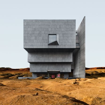 A series of dark gray volumes are stacked to form the Met Breuer museum, located on the Upper East Side. Here it rests on a caramel-colored, arid landscape.