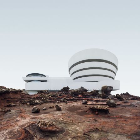 The white curves of the Guggenheim Museum, designed by Frank Lloyd Wright and George Cohen, stand out against a rocky landscape.