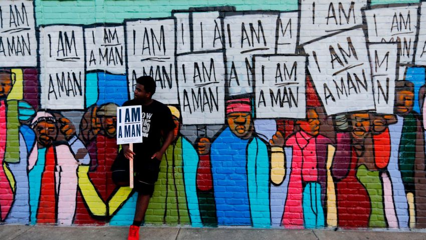 MEMPHIS, TN - APRIL 04: Xavier Hibler leans against a mural while marching through downtown during a Fight for $15 rally on April 4, 2017 in Memphis, Tennessee. About 1,000 people marched through downtown Memphis from City Hall to the National Civil Rights museum on the 49th anniversary of Dr. Martin Luther King, Jr.'s assassination. (Photo by Mike Brown/Getty Images)