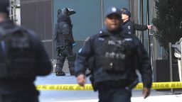 Police patrol outside the Time Warner Building on October 24, 2018 where a suspected explosive device was found in the building after it was delivered to CNN's New York bureau. - Suspected explosive devices were sent to former president Barack Obama, defeated presidential nominee Hillary Clinton and to a building housing CNN's New York bureau less than 24 hours apart and less than two weeks before key US midterm elections, officials confirmed Wednesday. The targeted Democrats are among the most high-profile political figures in the United States, which goes to the polls on November 6 in elections seen as a referendum on Republican President Donald Trump. (Photo by TIMOTHY A. CLARY / AFP)        (Photo credit should read TIMOTHY A. CLARY/AFP/Getty Images)