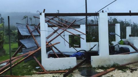 In this photo provided by Glen Hunter, damage from Super Typhoon Yutu is shown outside Hunter's home in Saipan, Commonwealth of the Northern Mariana Islands, Octover 25, 2018.