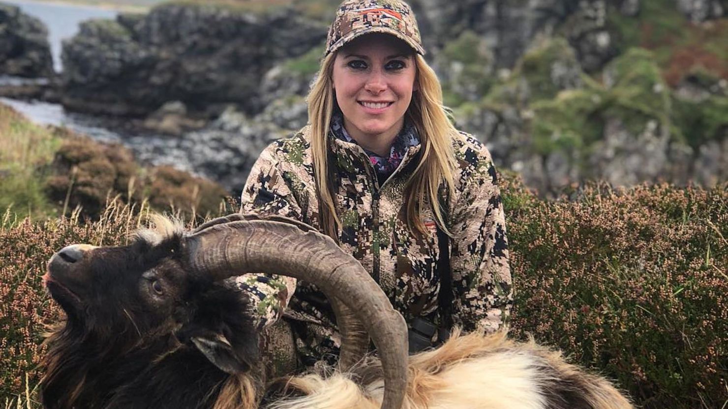 US hunter Larysa Switlyk poses with a dead wild goat on the Scottish island of Islay.