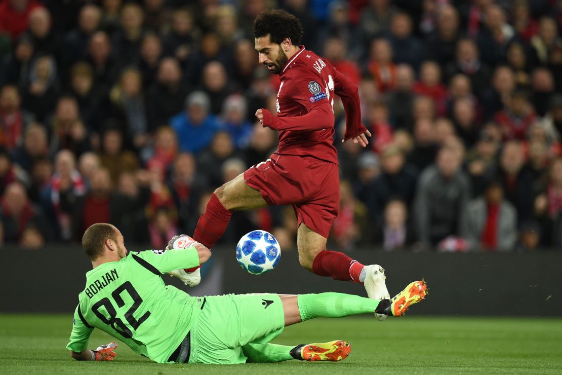 Red Star Belgrade's Milan Borjan saves at the feet of Liverpool midfielder Mohamed Salah.