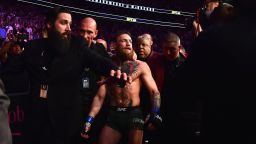 LAS VEGAS, NV - OCTOBER 06:  Conor McGregor of Ireland is escorted out of the octagon after being defeated by Khabib Nurmagomedov of Russia in their UFC lightweight championship bout during the UFC 229 event inside T-Mobile Arena on October 6, 2018 in Las Vegas, Nevada.  (Photo by Harry How/Getty Images)