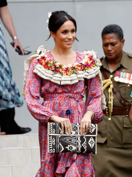 Meghan attended University of the South Pacific in Fiji wearing a printed wrap dress by <a href="https://www.modaoperandi.com/figue-pf18/frederica-printed-ruffle-dress" target="_blank" target="_blank">Figue</a> on October 24.
