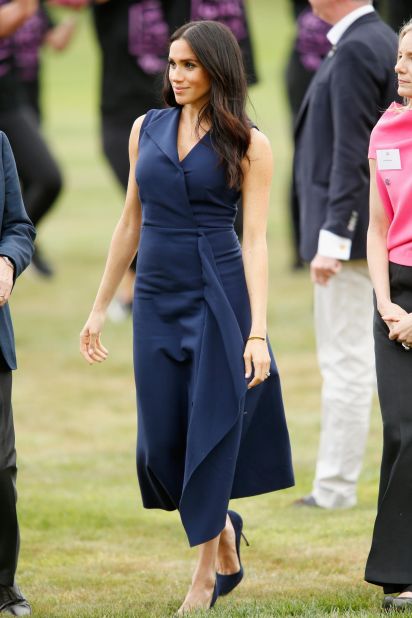 Meghan wore a navy dress by <a href="https://www.dionlee.com/shop/dion-lee/dresses/folded-sail-dress-a9564-p19/281031" target="_blank" target="_blank">Dion Lee </a>to a Government House in Melbourne on October 18. 