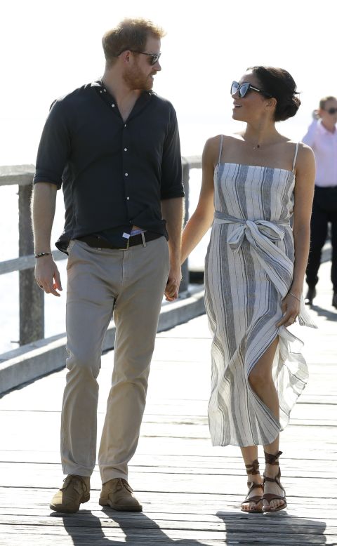 Meghan wore a <a href="https://www.thereformation.com/products/pineapple-dress??utm_source=TnL5HPStwNw&utm_medium=10&utm_campaign=LinkShare&sid=LS298X102&ranMID=40090&ranEAID=2116208&ranSiteID=TnL5HPStwNw-ybidd3RlVqnH0Zf0dUcDJA" target="_blank" target="_blank">Reformation</a> dress at the Kingfisher Bay Jetty on Fraser Island, Australia on October 22. 