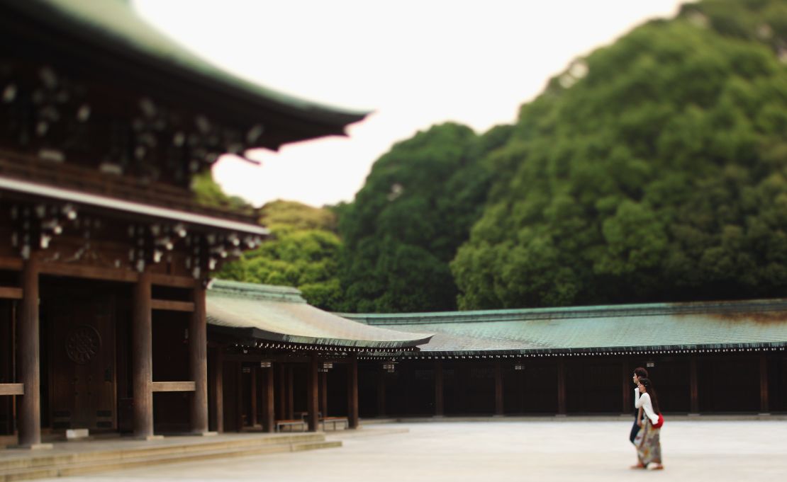 Vistors walk through the Meiji Shrine. 