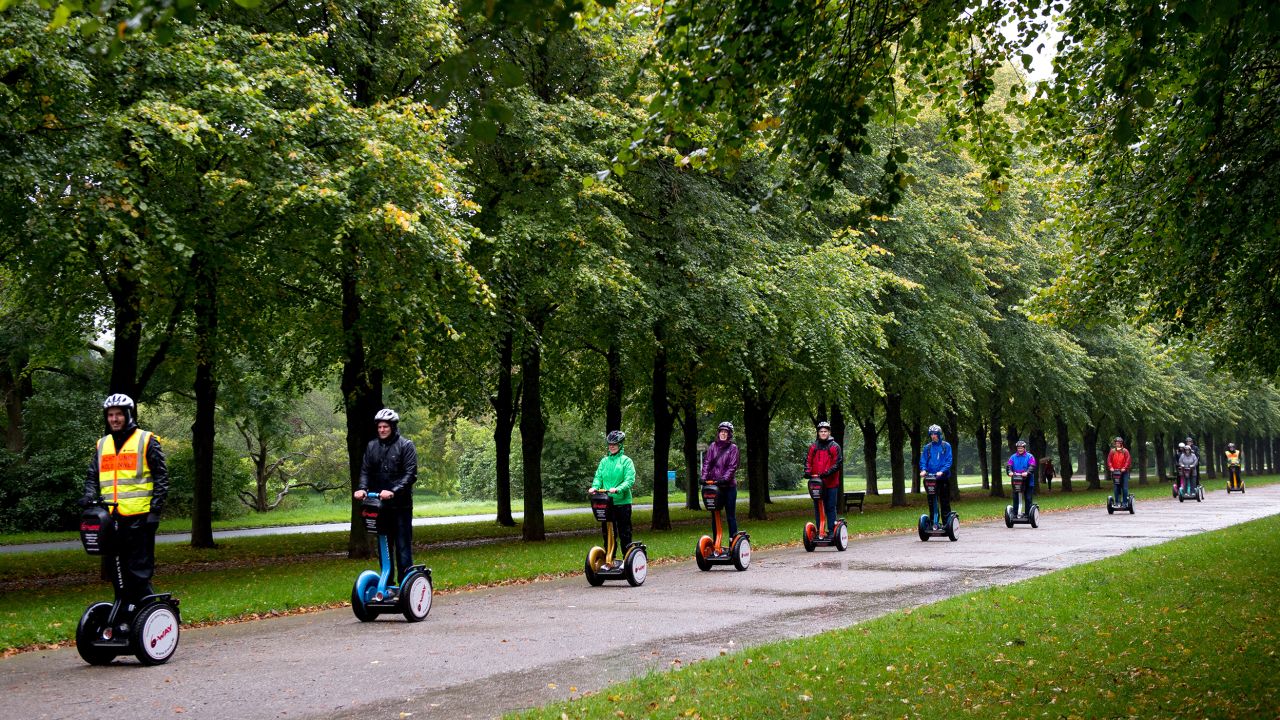 A Segway tour passes through Hanover, Germany. (Photo by Swen Pförtner/picture alliance via Getty Images)