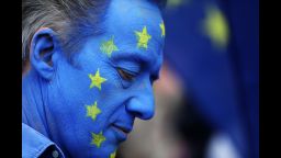 A demonstrator wears face paint in a European Union (EU) flag design ahead of the anti-Brexit People's Vote march, in London, U.K., on Saturday, Oct. 20, 2018. U.K. Prime Minister Theresa May is said to be ready to ditch one of her key Brexit demands in order to resolve the vexed issue of the Irish border and clear the path to a deal, according to people familiar with the matter. Photographer: Chris Ratcliffe/Bloomberg via Getty Images