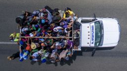 Aerial view of Honduran migrants onboard a truck as they take part in a caravan heading to the US, in the outskirts of Tapachula, on their way to Huixtla, Chiapas state, Mexico, on October 22, 2018. - President Donald Trump on Monday called the migrant caravan heading toward the US-Mexico border a national emergency, saying he has alerted the US border patrol and military. (Photo by PEDRO PARDO / AFP)        (Photo credit should read PEDRO PARDO/AFP/Getty Images)