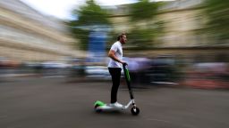 A man rides a dock-free electric scooter Lime-S by California-based bicycle sharing service Lime during a presentation of new alternative urban mobility options at Paris city hall, France, July 19, 2018. REUTERS/Gonzalo Fuentes
