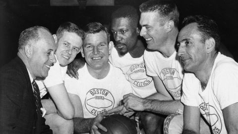 Bob Cousy, right, and Bill Russell pose for a team photo in 1963 with coach Red Auerbach.