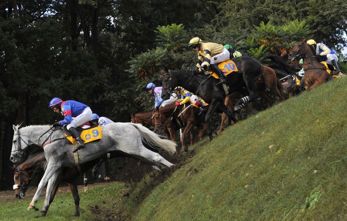 Jockeys compete at the Velka Pardubicka Steeplechase in Pardubice, Czech Republic. The annual race is not just the world's oldest cross-country horse race -- but also arguably the most difficult. 