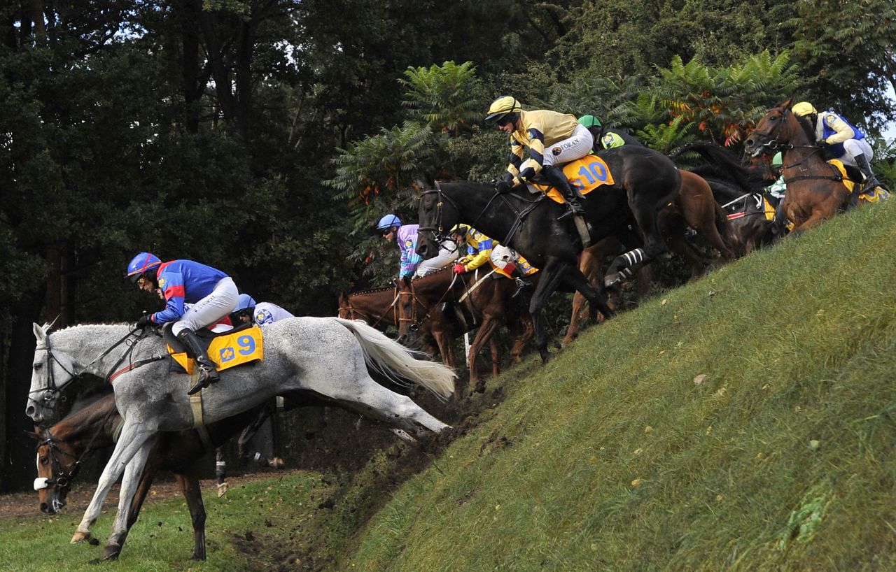 Jockeys compete at the Velka Pardubicka Steeplechase in Pardubice, Czech Republic. The annual race is not just the world's oldest cross-country horse race -- but also arguably the most difficult. 