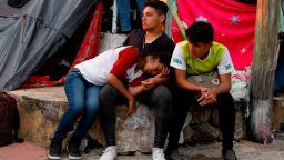 Central American migrants rest as a thousands-strong caravan slowly making its way toward the U.S. border stops for the night in Pijijiapan, Chiapas state, Mexico, Thursday, Oct. 25, 2018. Little by little, sickness, fear, and police harassment are whittling down the migrant caravan making its way to the U.S. border, with many of the 4,000 to 5,000 migrants camped overnight in the southern town of Mapastepec complaining of exhaustion.(AP Photo/Rebecca Blackwell)