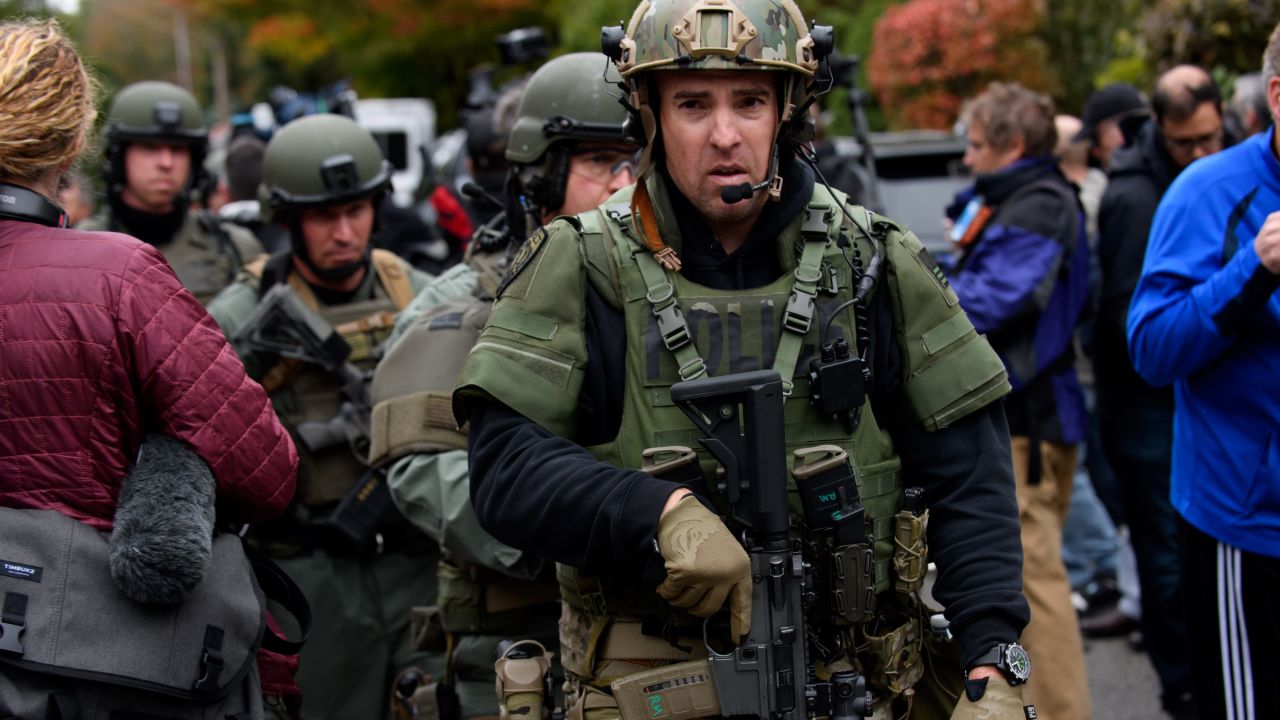 Rapid reaction SWAT members leave the scene of the mass shooting on Saturday.