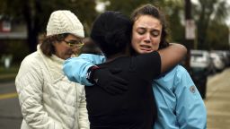 From left, Kate Rothstein looks on as Tammy Hepps hugs Simone Rothstein, 16, after multiple people were shot at The Tree of Life Congregation synagogue