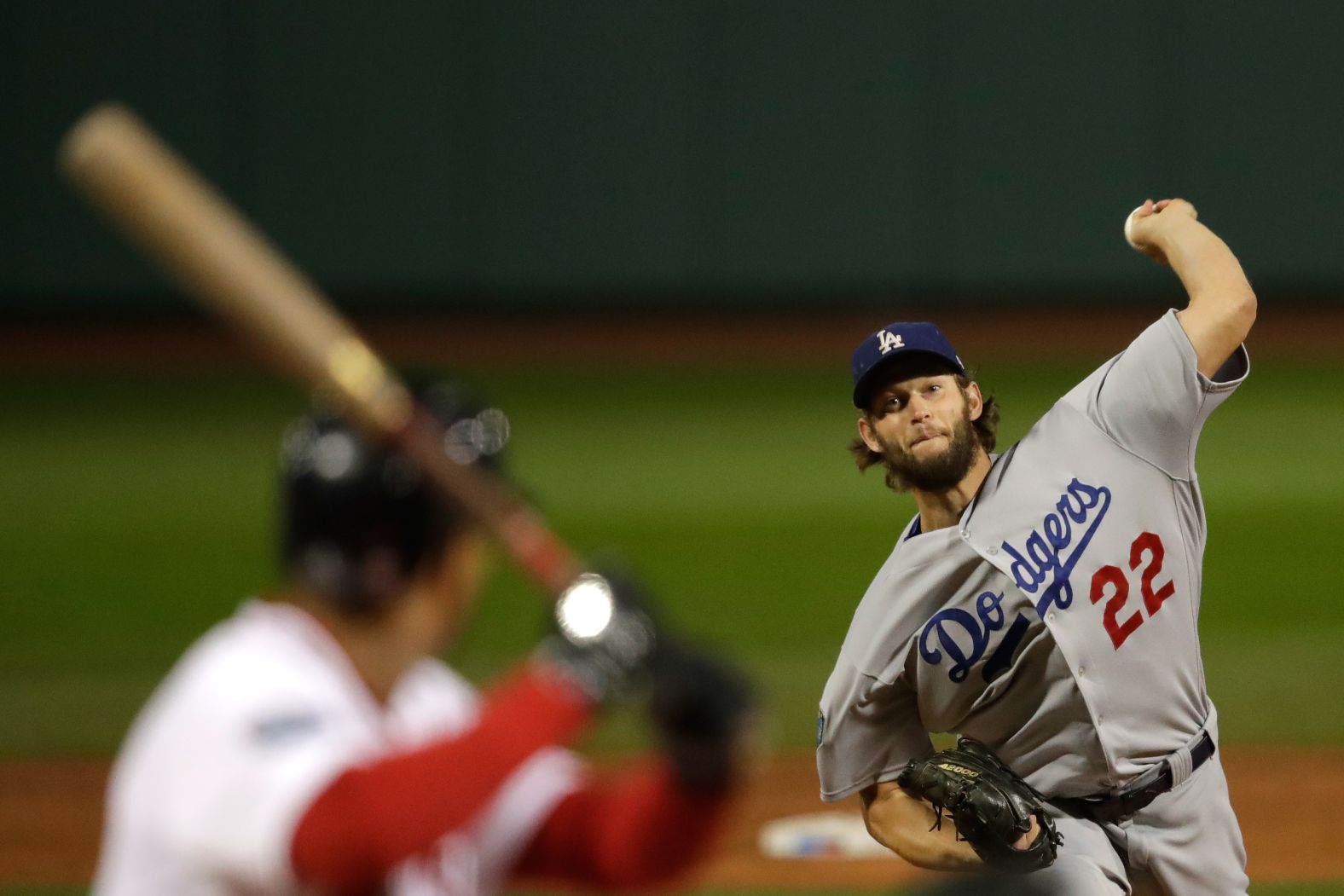 Clayton Kershaw of the Los Angeles Dodgers delivers a pitch during the first inning against the Boston Red Sox in Game 1. Kershaw was given the loss after giving up five runs over four innings pitched.