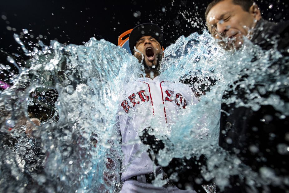 Eduardo Nuñez of the Boston Red Sox is doused with Gatorade after Boston's Game 1 win  at Fenway Park in Boston on Tuesday, October 23.