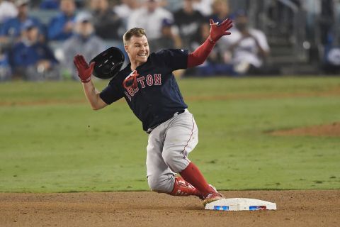 Brock Holt of the Red Sox slides into second base on a one-out double to left field in the ninth inning of Game 4 at Dodger Stadium on Saturday, October 27.