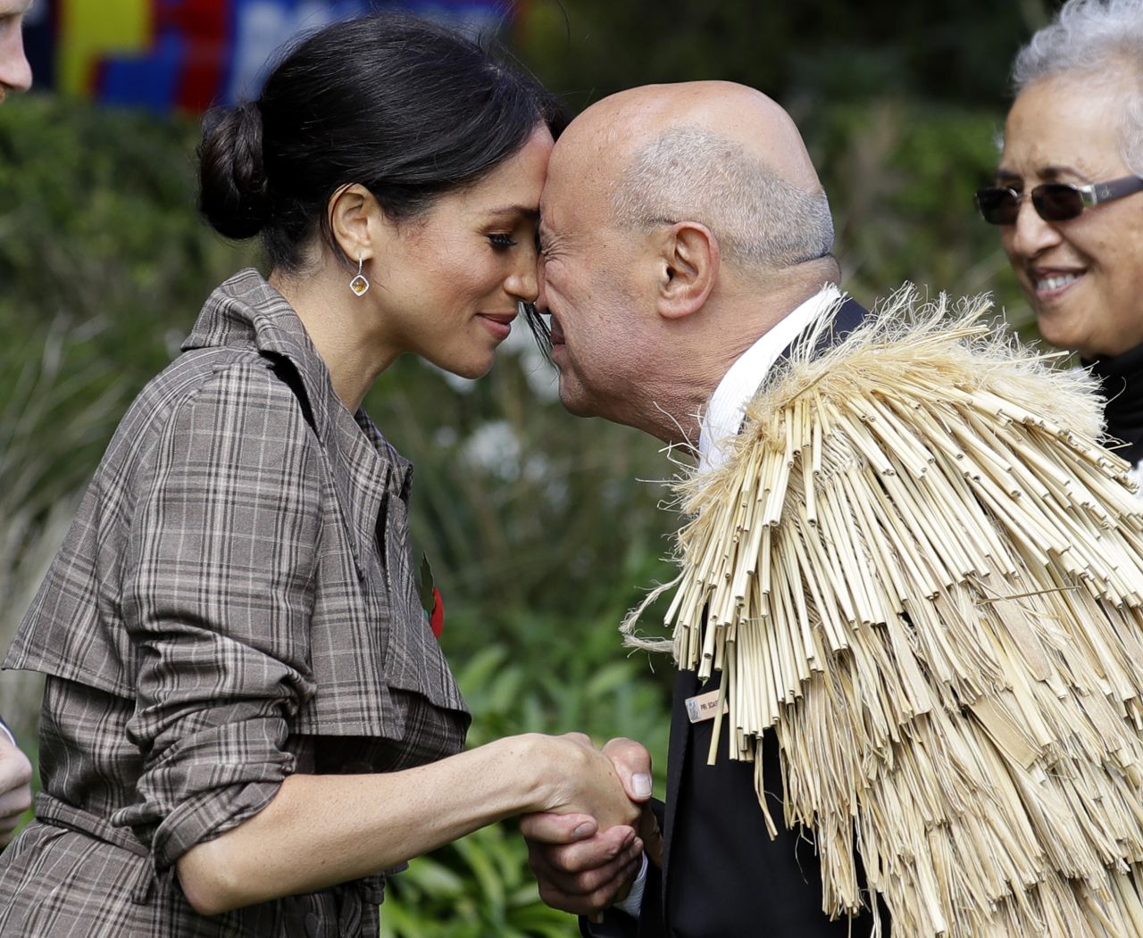 Meghan receives a "hongi," or traditional Maori welcome, on the lawns of Government House in Wellington, New Zealand, on Sunday.