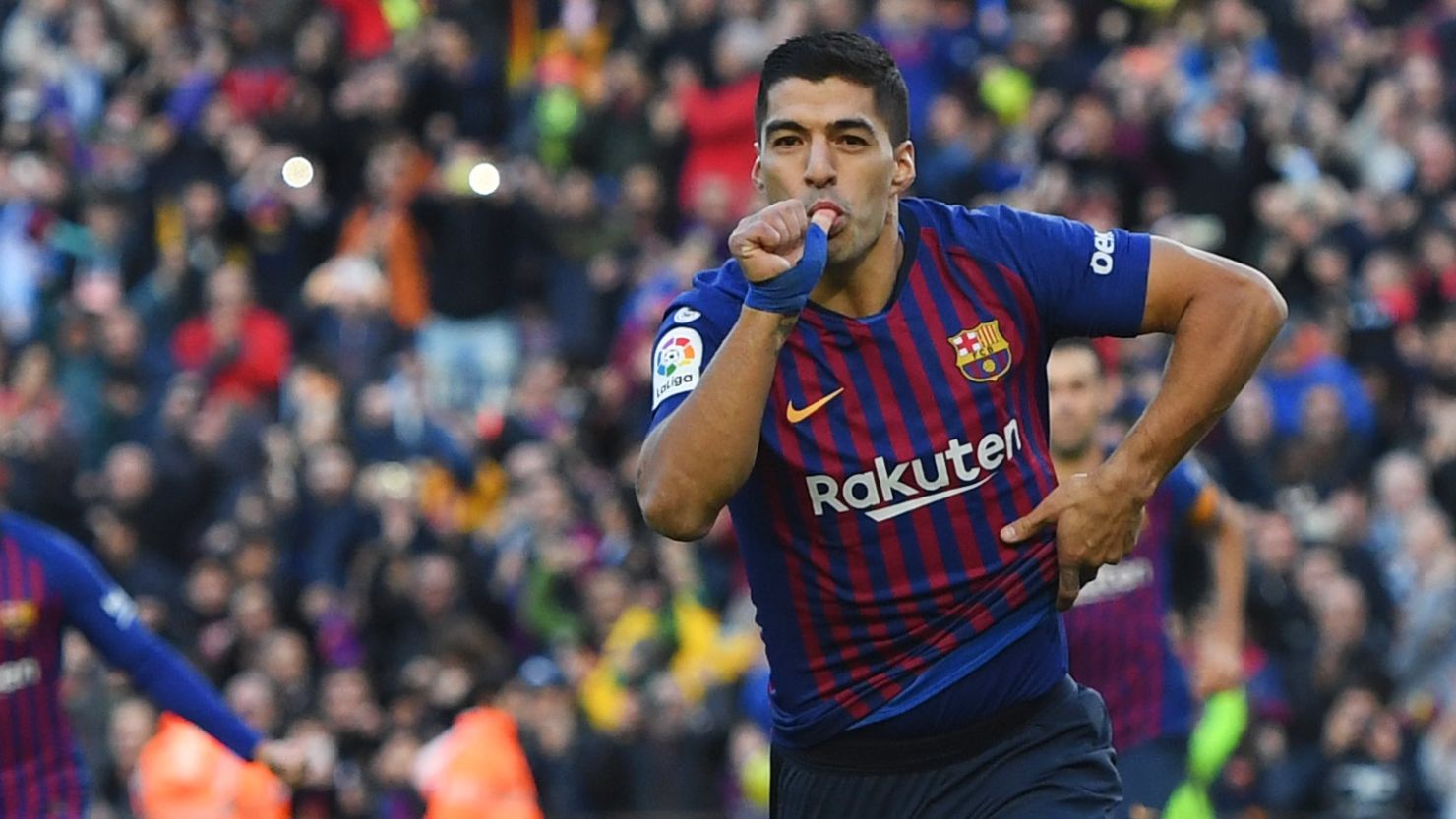 Luis Suarez celebrates scoring the first of his triple for Barcelona in the El Clasico win over Real Madrid in the Nou Camp. 