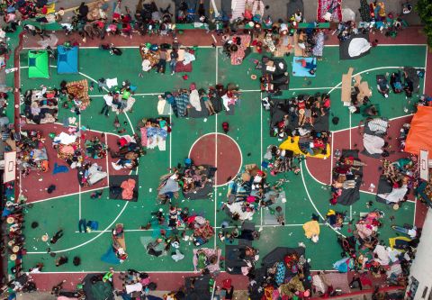 Migrants heading in a caravan to the United States rest on a basketball court in San Pedro Tapanatepec, Mexico. on Sunday, October 28.
