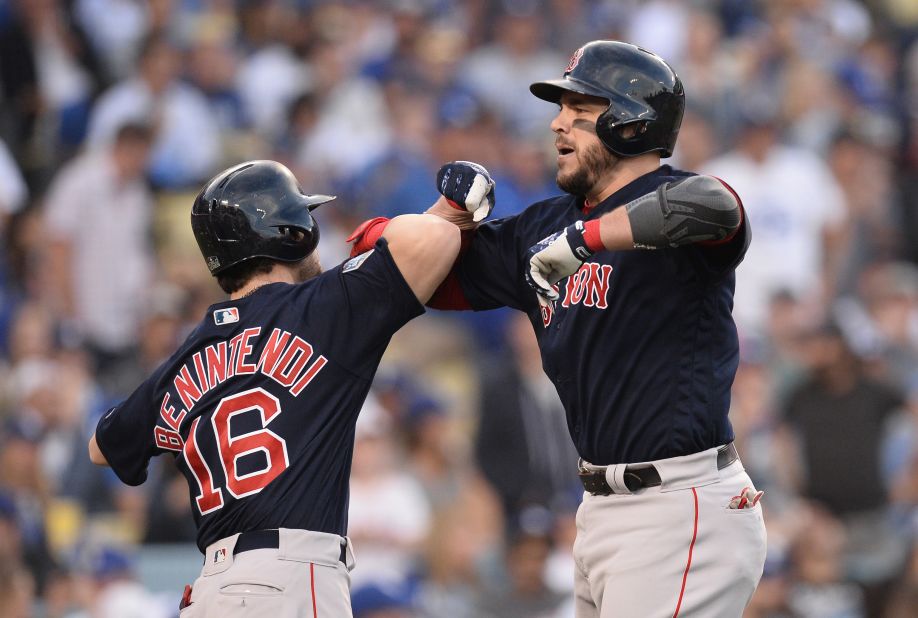 Red Sox first baseman Steve Pearce celebrates scoring with outfielder Andrew Benintendi after hitting a two-run home run in the first inning against Dodgers in Game 5.