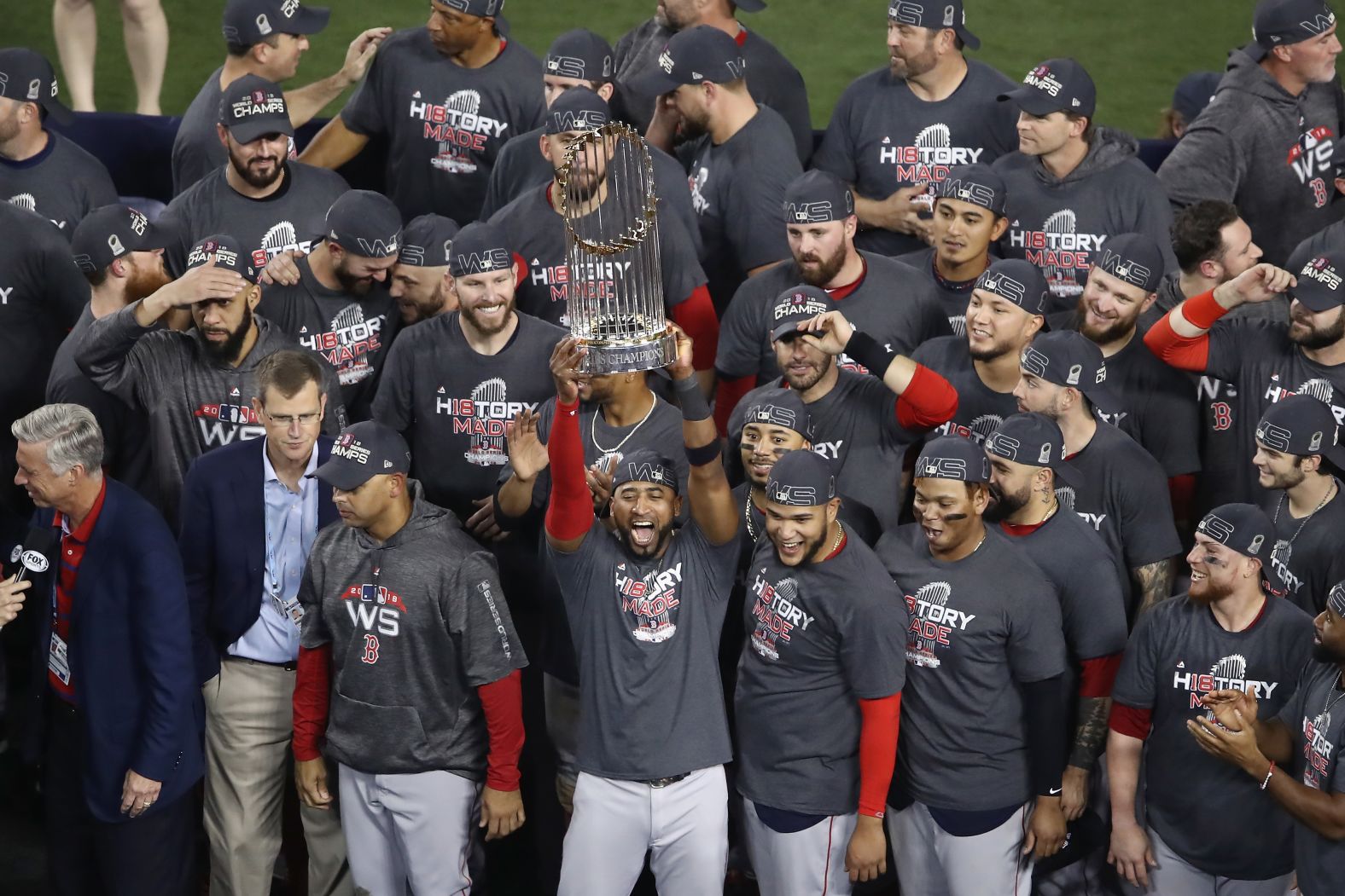 The Boston Red Sox celebrate with the World Series trophy after their Game 5 win over the Los Angeles Dodgers.