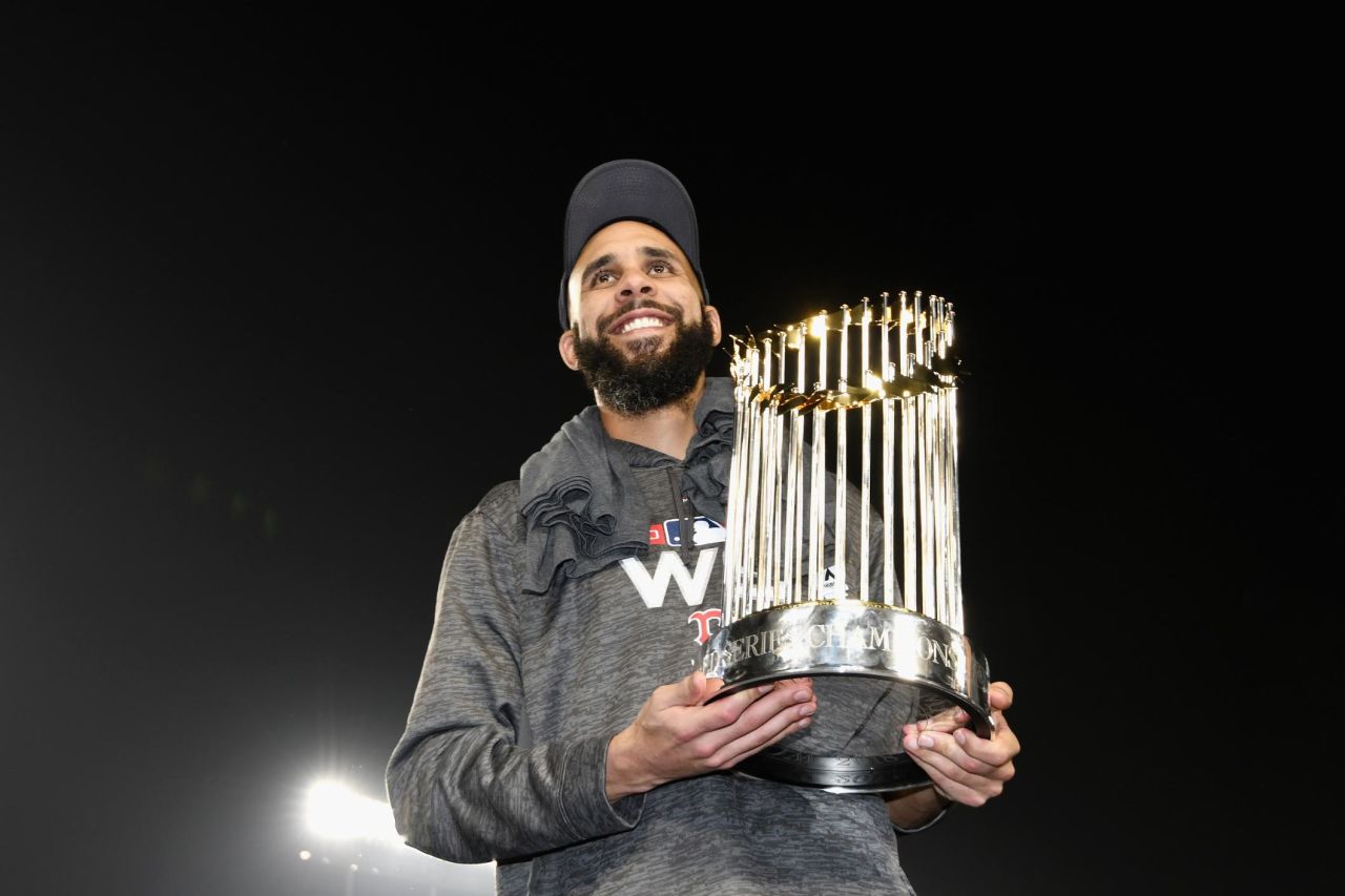 David Price of the Boston Red Sox poses with the World Series trophy after Boston's Game 5 win over the Los Angeles Dodgers.