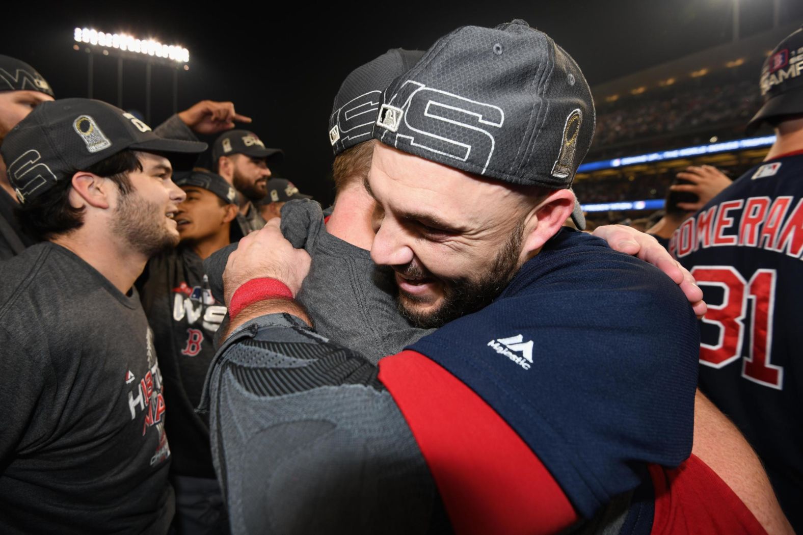 World Series MVP Steve Pearce celebrates with a teammate.