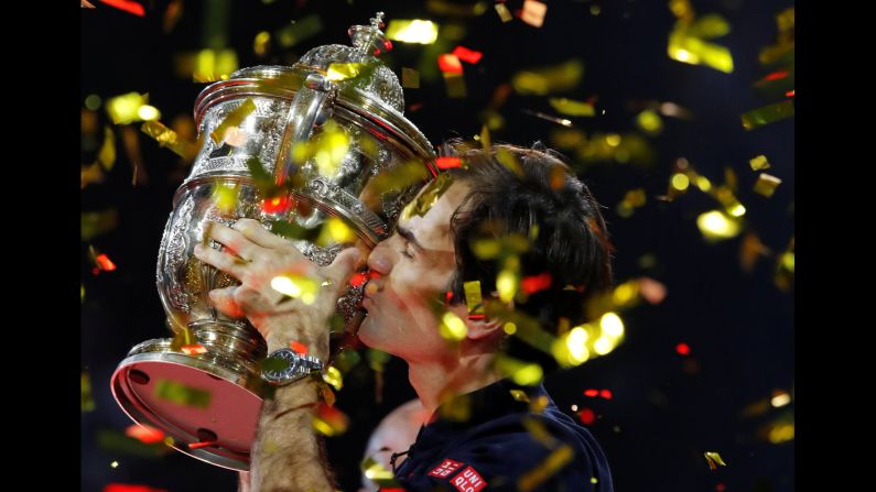 Roger Federer kisses his trophy after winning the Swiss Indoors final on Sunday, October 28.