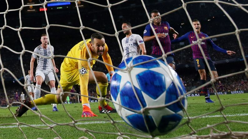 Inter Milan goalkeeper Samir Handanovic watches a goal slip past him during a Champions League match against Barcelona on Wednesday, October 24. Barcelona won 2-0.