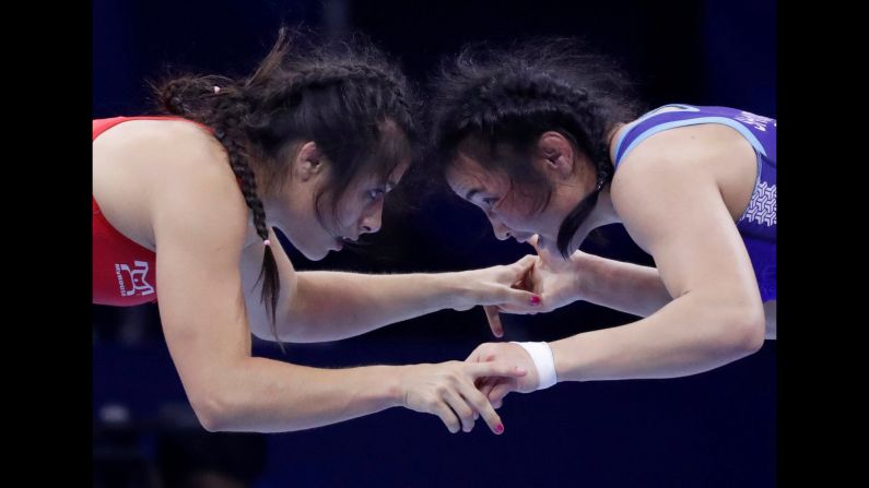 Mexico's Alejandra Romero Bonilla faces off against Mongolia's Shoovdor Baatarja during the World Wrestling Championships on Tuesday, October 23.