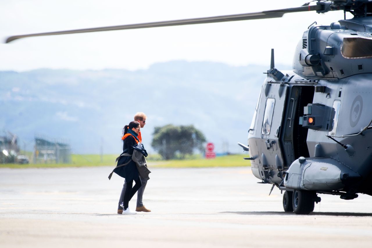 Britain's Prince Harry and Meghan, the Duchess of Sussex, arrive at the military terminal to board an Air Force NH90 helicopter that will take them to Tasman in Wellington on Monday, October 29.