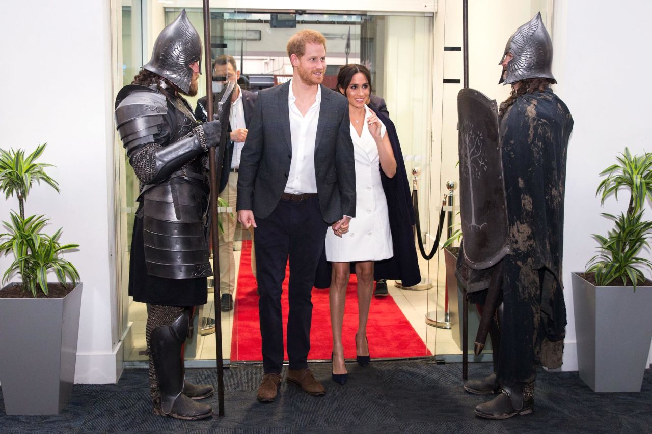 Britain's Prince Harry and Meghan Markle, Duchess of Sussex, arrive at Courtney Creative in Wellington, New Zealand, on Monday, October 29.