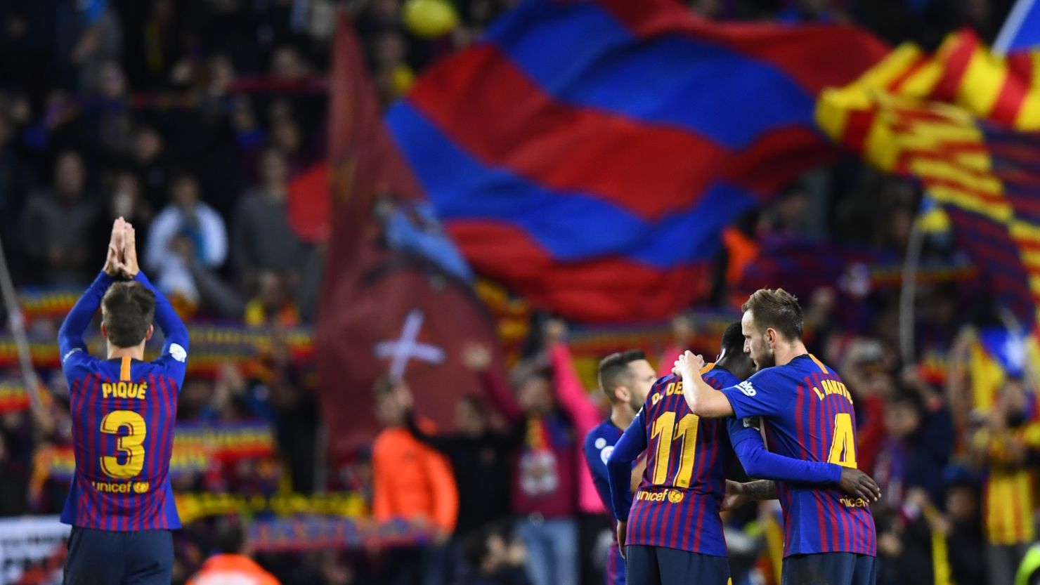 Barcelona players celebrate at the end of the La Liga match at the Camp Nou stadium in Barcelona.