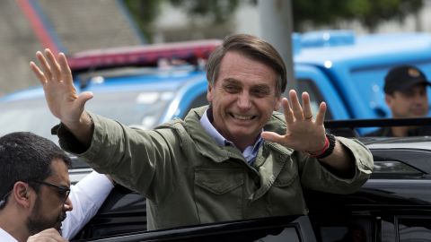Jair Bolsonaro waves after voting in the presidential runoff election in Rio de Janeiro on October 28.