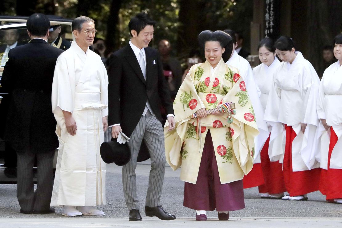 Japanese Princess Ayako, dressed in traditional ceremonial gown, and Japanese businessman Kei Moriya, arrive at Meiji Shrine for their wedding ceremony in Tokyo,  Oct. 29, 2018.