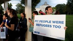 WASHINGTON, DC - SEPTEMBER 14: People holds signs during a demonstration organized by HIAS, founded as the Hebrew Immigrant Aid Society, outside the U.S. Capitol September 14, 2017 in Washington, DC. Protestors are calling on President Trump to increase the number of refugees resettled in the United States. 