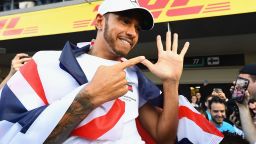 MEXICO CITY, MEXICO - OCTOBER 28:  2018 F1 World Drivers Champion Lewis Hamilton of Great Britain and Mercedes GP celebrates with his team after the Formula One Grand Prix of Mexico at Autodromo Hermanos Rodriguez on October 28, 2018 in Mexico City, Mexico.  (Photo by Clive Mason/Getty Images)