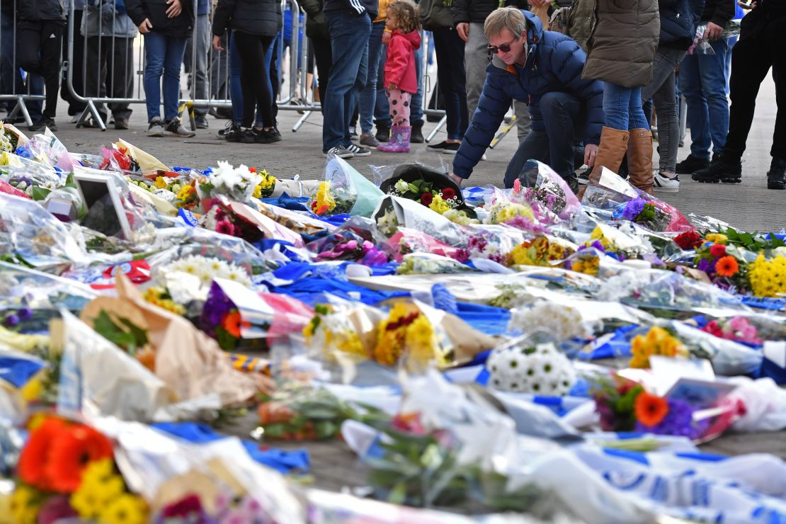 Flowers are piled up outside the King Power Stadium in Leicester following the death of the club's owner in a helicopter crash. 
