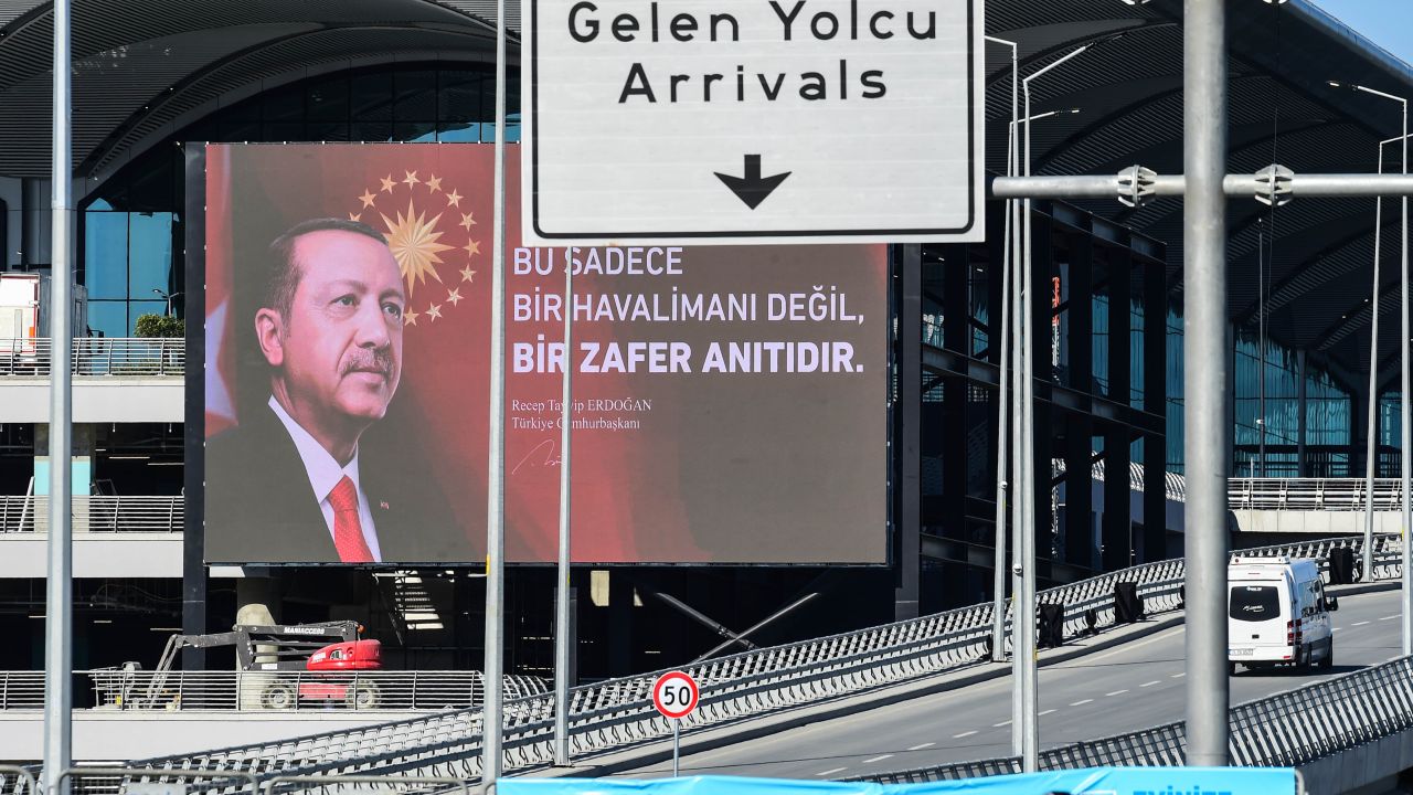 The terminal of the new Istanbul Airport, with a banner featuring Turkish President Recep Tayyip Erdogan.