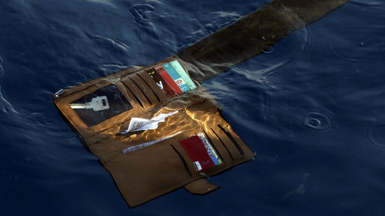 A wallet belonging to a victim of the Lion Air passenger jet that crashed is seen in the waters of Ujung Karawang, West Java, Indonesia, Monday, Oct. 29, 2018. A Lion Air flight crashed into the sea just minutes after taking off from Indonesia's capital on Monday in a blow to the country's aviation safety record after the lifting of bans on its airlines by the European Union and U.S. (AP Photo/Achmad Ibrahim)