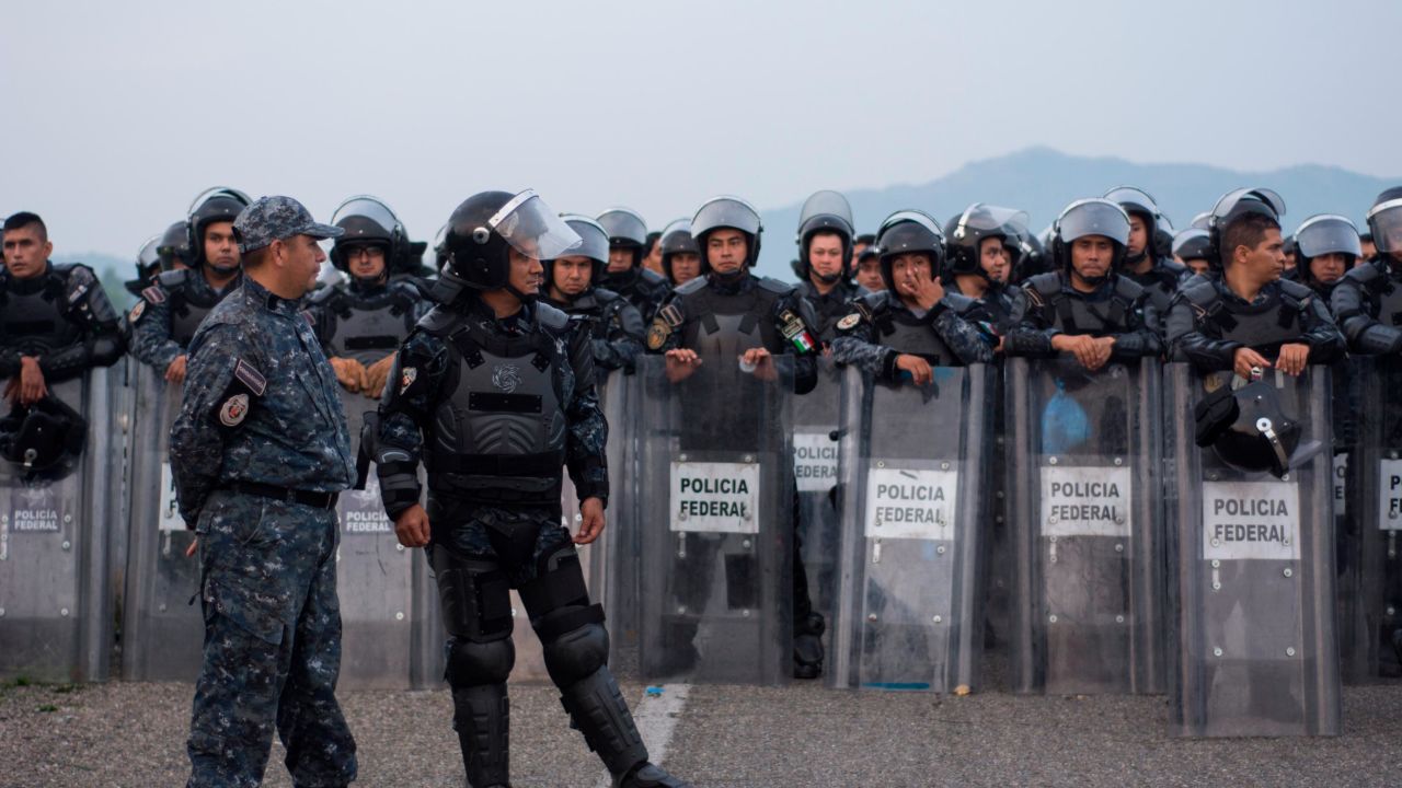 Police said they blocked the caravan to explain Mexico's offer of aid.
