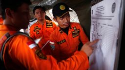 Indonesian rescue team members update a manifest chart as they work to retrieve the bodies of those who perished in the Lion Air flight JT610 crash, at Tanjung Priok port in Jakarta, Indonesia, October 30, 2018. REUTERS/Edgar Su