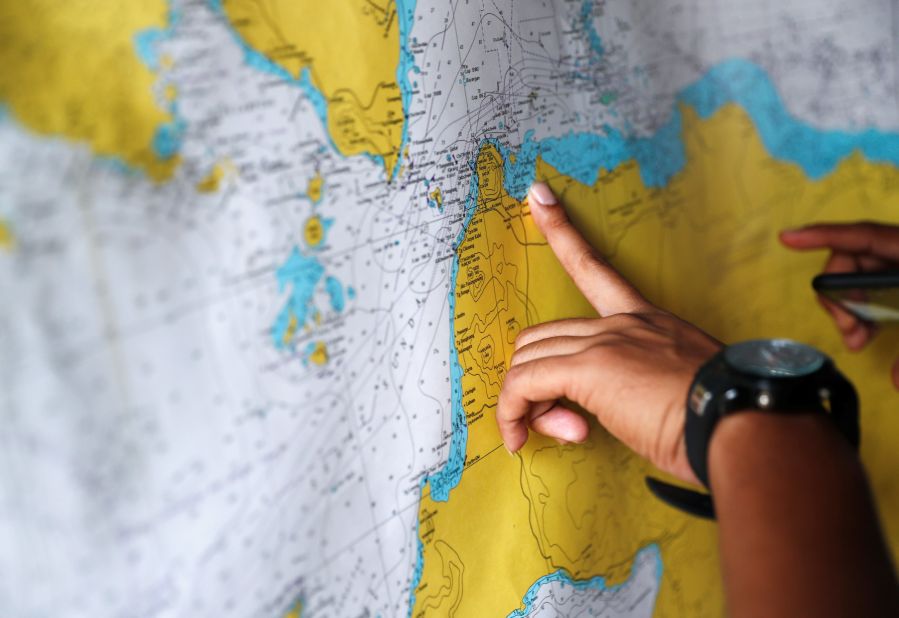 A police officer studies a map in the search-and-rescue command center.