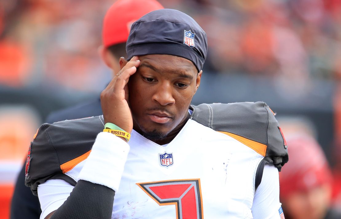 Buccaneers quarterback Jameis Winston stands in the bench area after being replaced by Ryan Fitzpatrick against the Bengals.