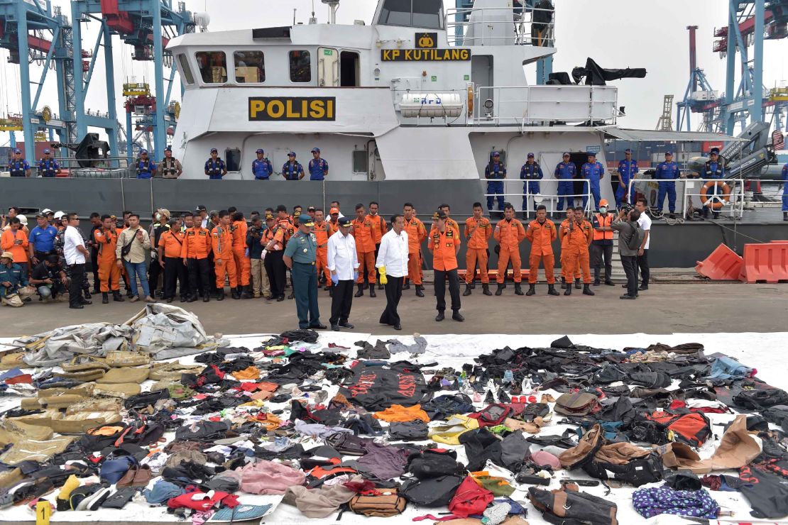 Indonesia's President Joko Widodo tours the operations centre as recovered debris from the ill-fated Lion Air flight JT 610 are laid out at a port in northern Jakarta.